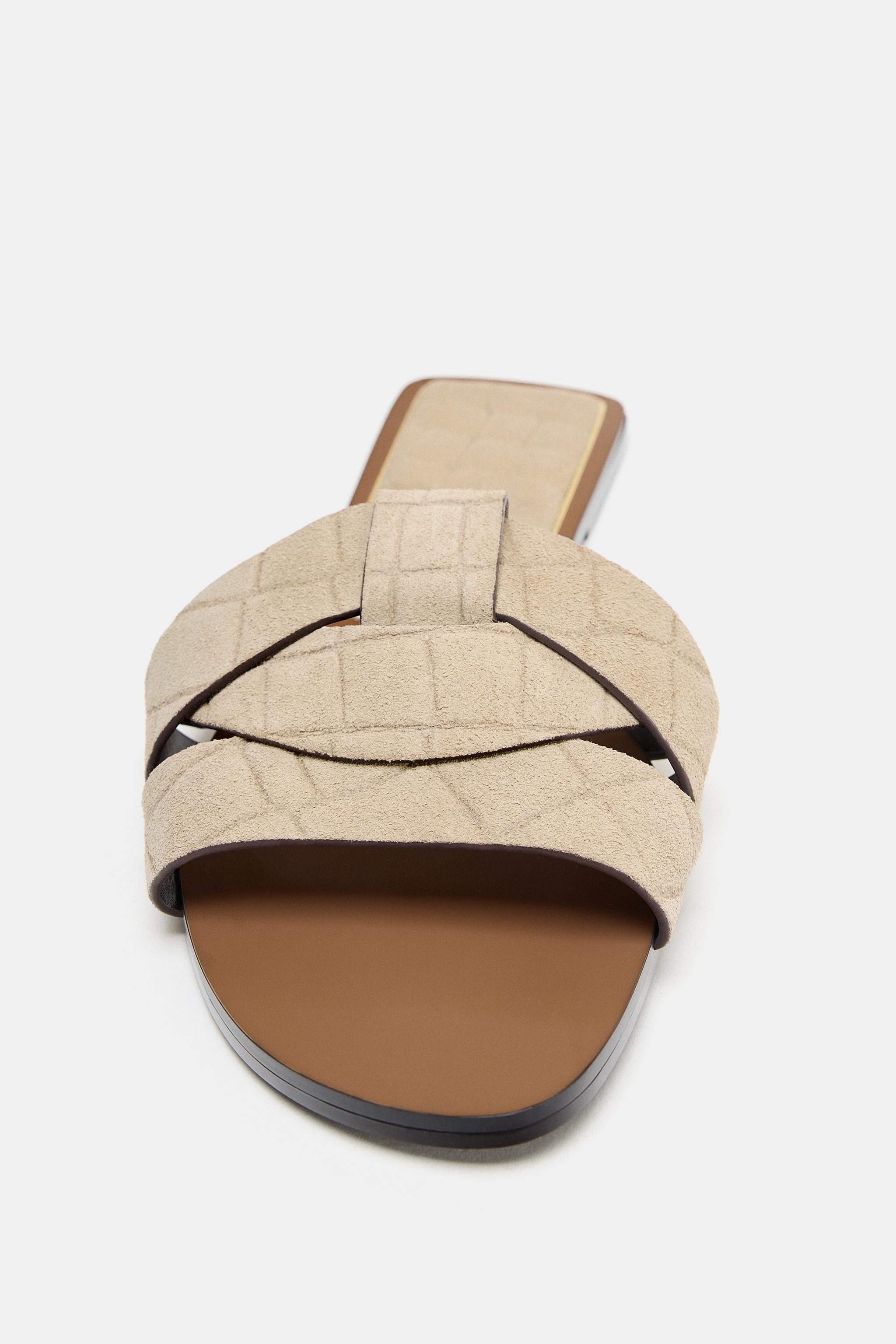 CROSSED LEATHER FLAT SANDALS